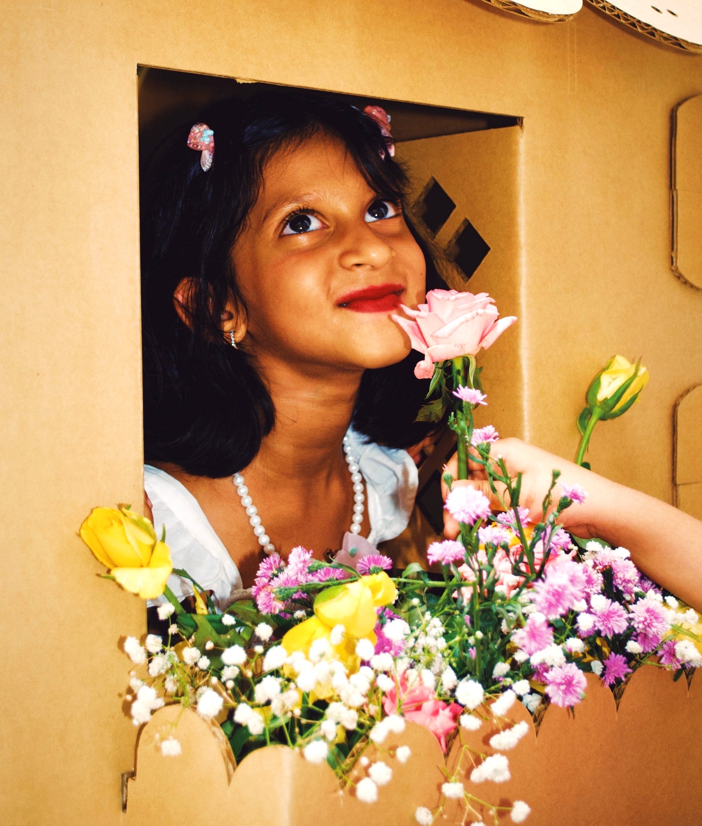 A child playing in a DUDUK playhouse