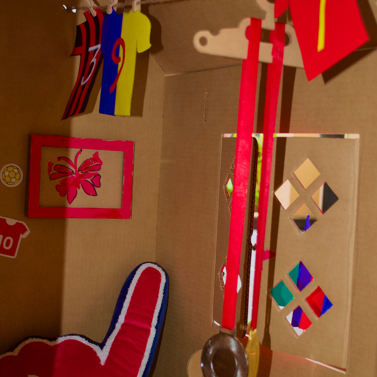 Decorated inside wall of a DUDUK Cubby House with hangers