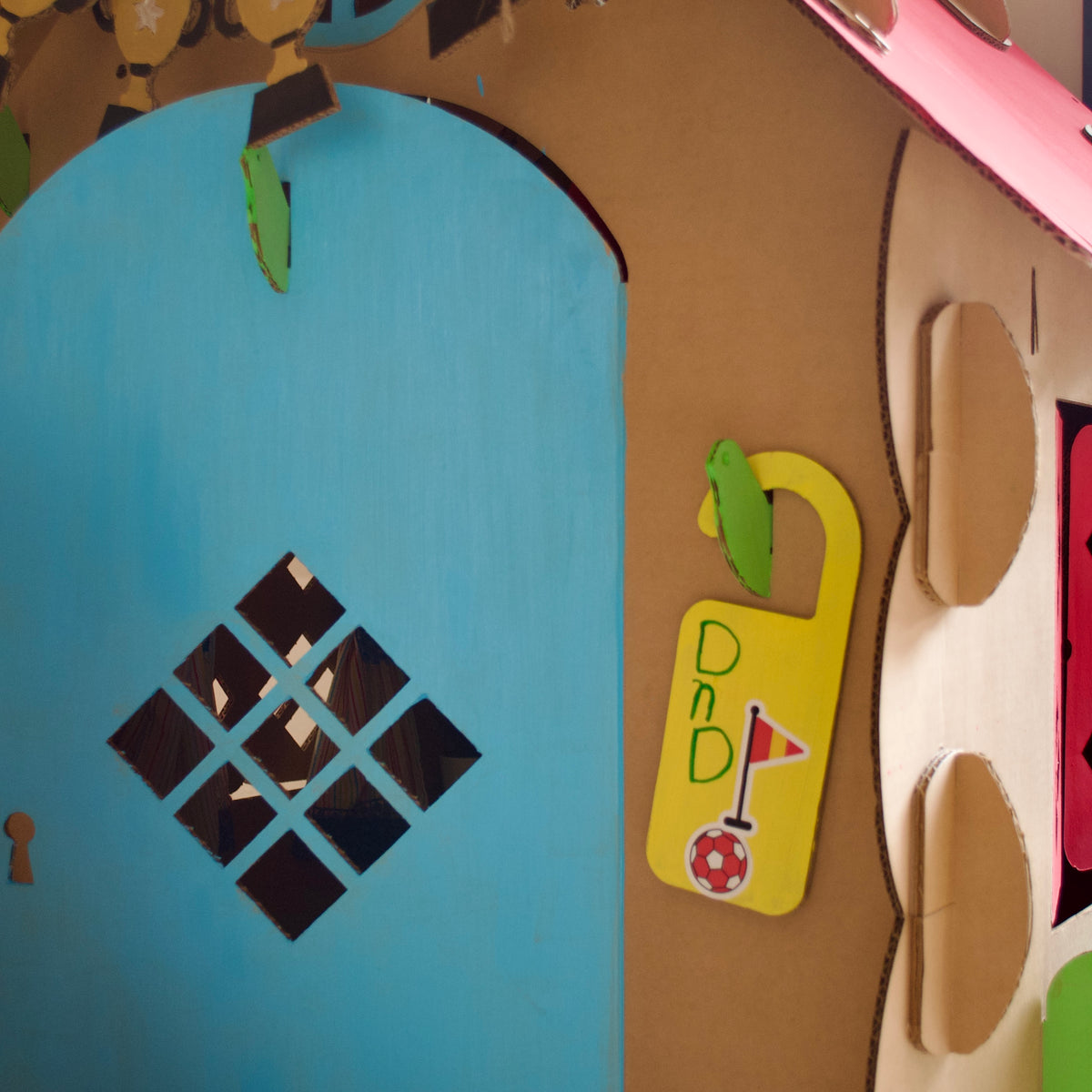 Blue door of a DUDUK Cubby House with a door tag