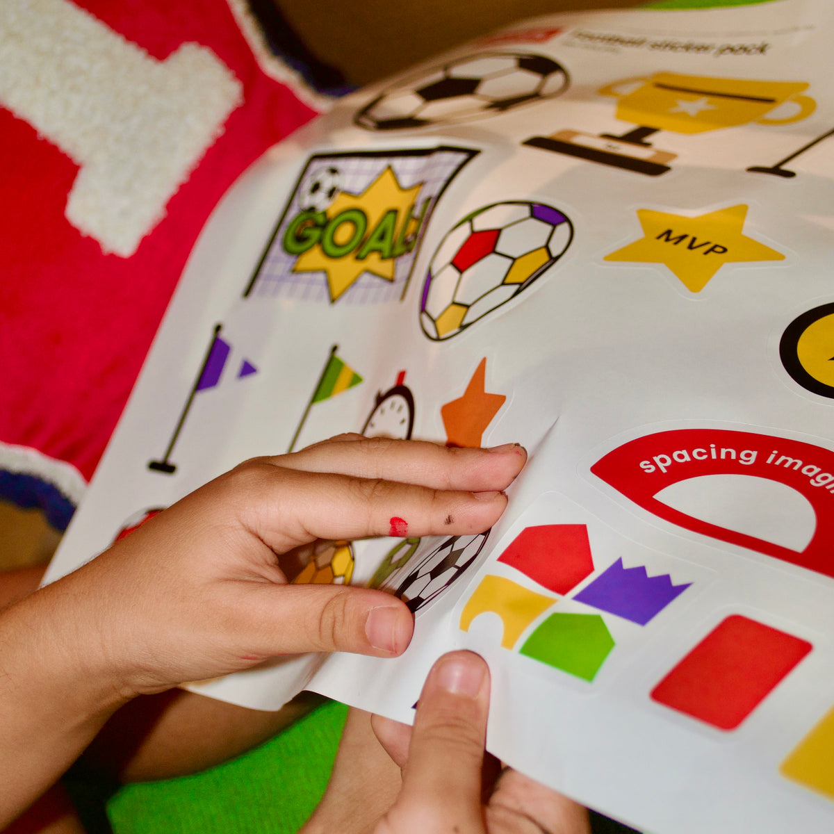 Football sticker sheet peeling, ready to decorate a DUDUK cubby house