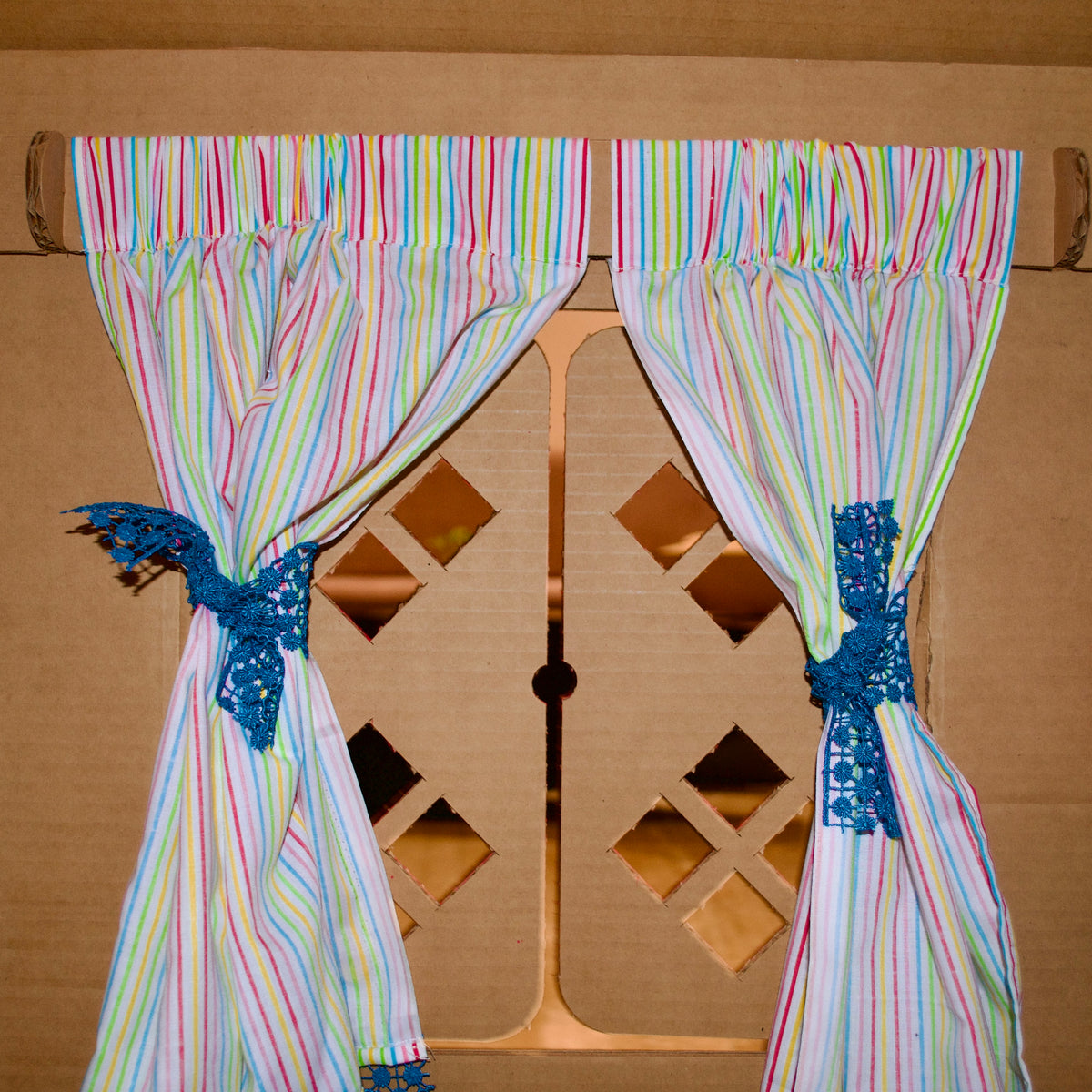 Cotton curtains and a trophy shelf inside a DUDUK Cubby House