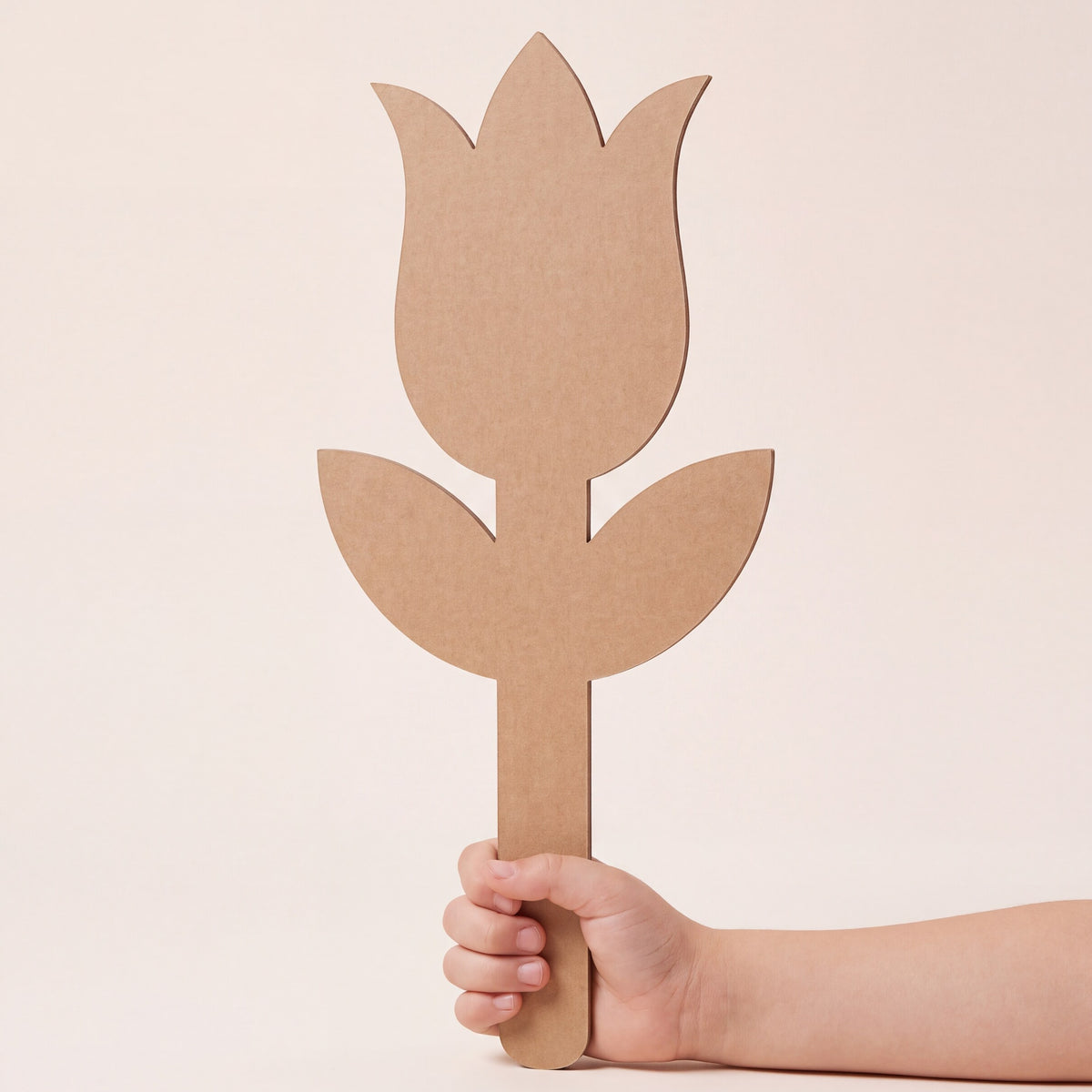 Child holding a DUDUK Flower Kit tulip