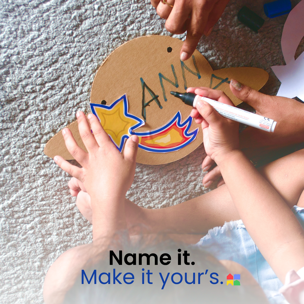 Child writing a name on the DUDUK Rocket name plate